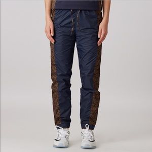 Nike Women’s Woven Track Pants Navy Floral Side Panels Drawstring Size S NWT